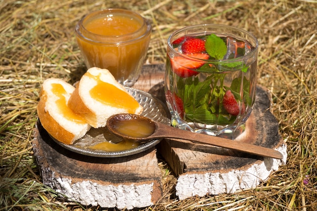 Tea with mint and strawberries in a glass