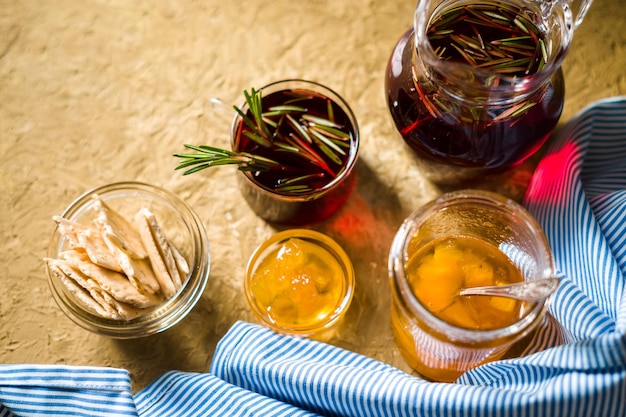 Tea with rosemary pineapple jam and blue striped napkin horizontal