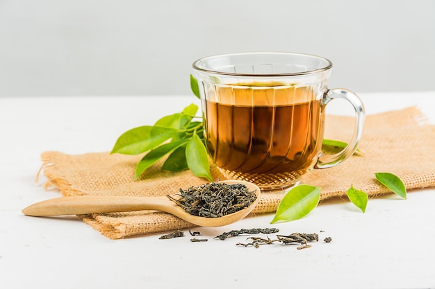 Photo tea with  tea glass on white wood