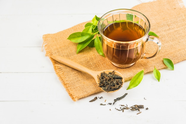 Photo tea with  tea glass on white wood