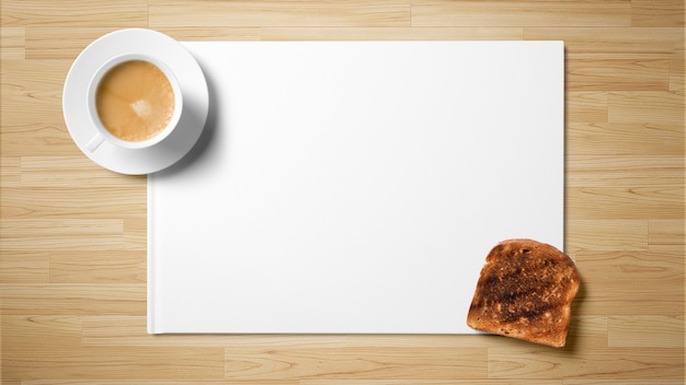 Photo tea with toast on white paper on wooden background