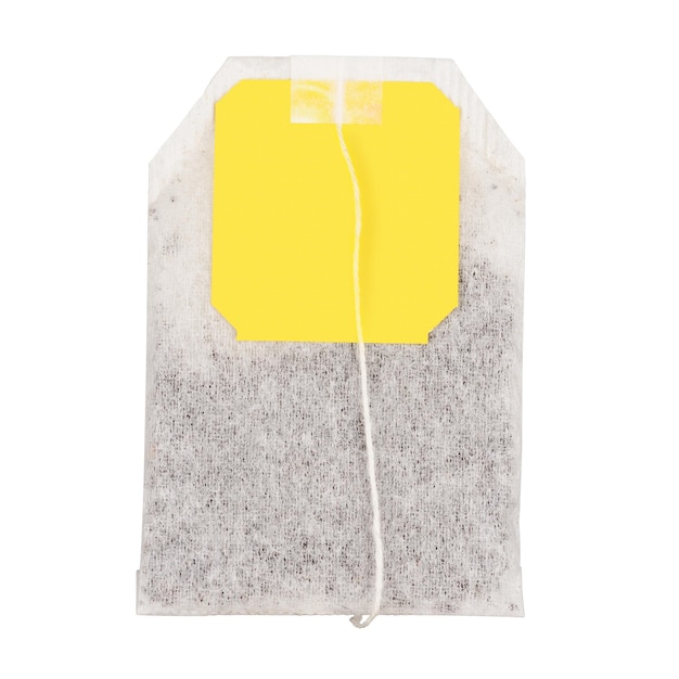 Teabag with yellow label Isolated on white background With clipping path