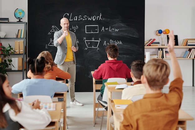 Premium Photo | Teacher asking a question to the class