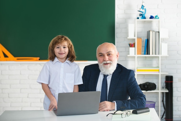 Teacher and child in classroom education concept school learning concept boy elementary school old a