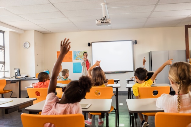 Teacher giving lesson to her students