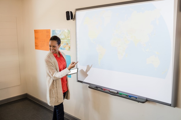 Teacher giving lesson to her students