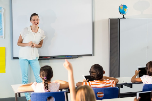 Teacher giving a lesson to pupils