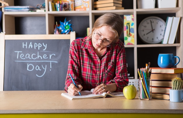 Teacher pretty woman enjoy educational process in classroom. Teachers day.