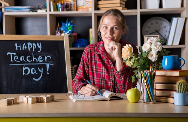 Teacher pretty woman enjoy educational process in classroom. Teachers day.