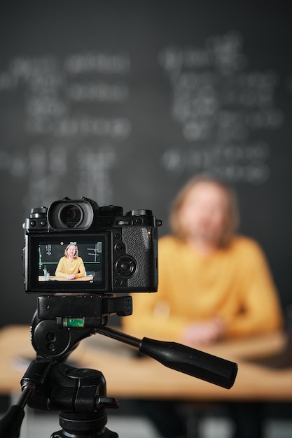 Teacher recording lesson on professional camera