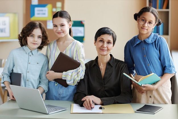 Teacher teaching lesson to her students