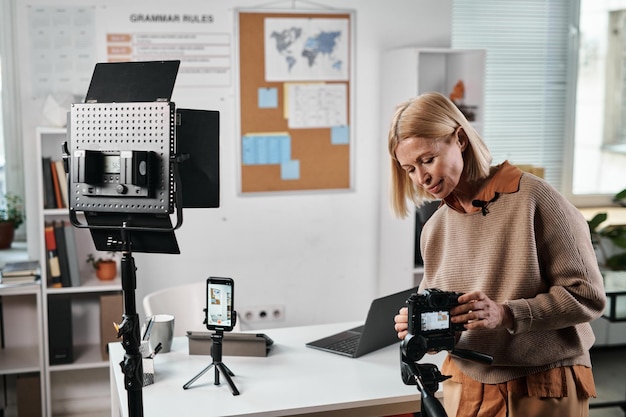 Teacher using professional camera for online lesson