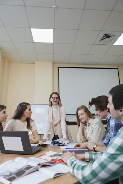 Teacher with college students in class