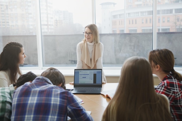 Teacher with college students in class