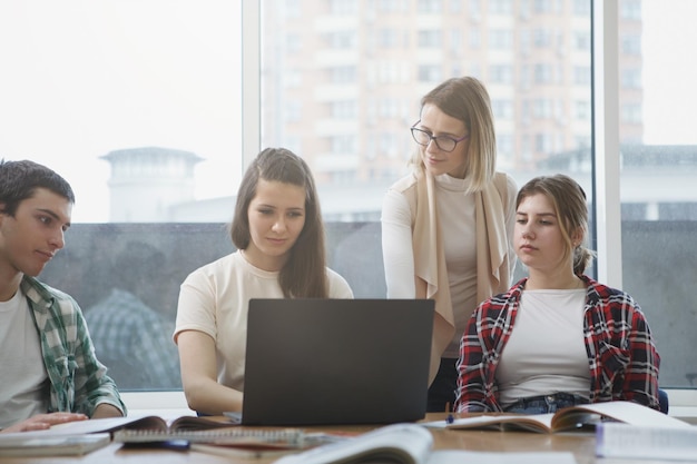 Teacher with college students in class