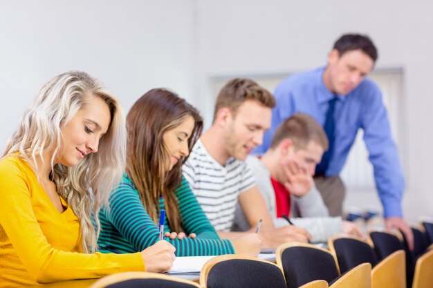 Teacher with college students in the classroom