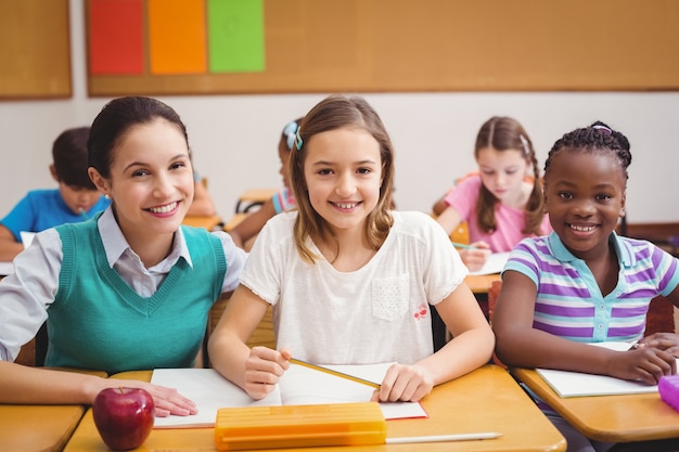 Photo teacher with pupils during class