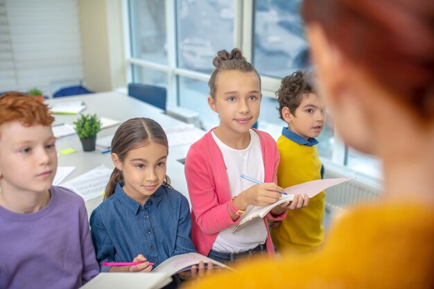 The teacher working with a small group of kids