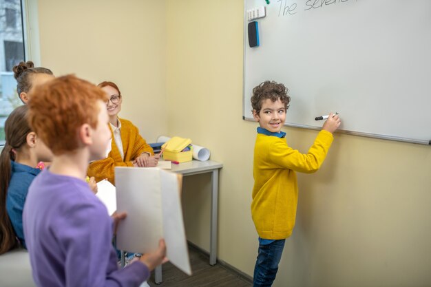 The teacher working with a small group of kids