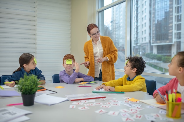 The teacher working with a small group of kids