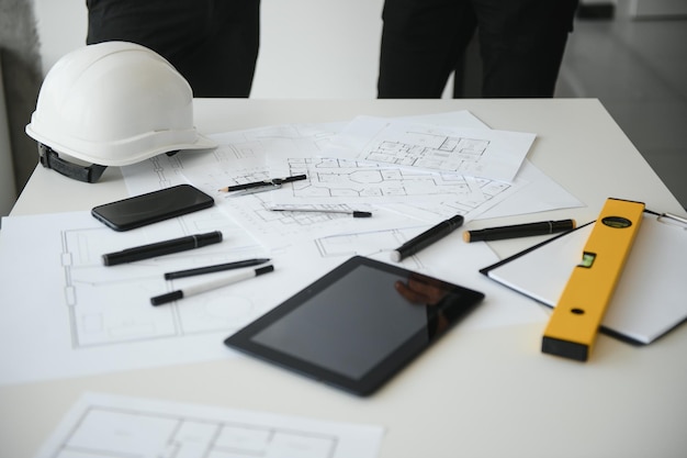 Team of architects people in group on construciton site check documents and business workflow