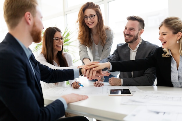 Team of architects working together on project in office