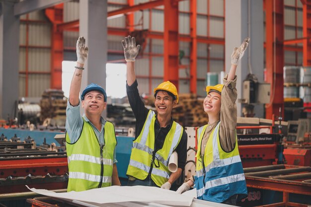 Team Asian engineer working control machine in factory