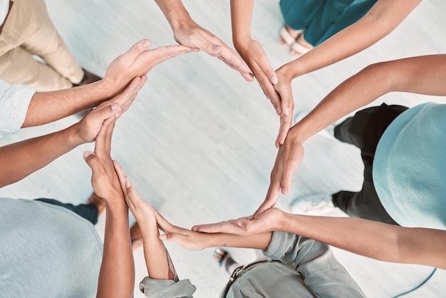 Photo team building support and business people with hands in a circle for partnership collaboration and teamwork at work corporate workers with a mission community or solidarity for trust from above