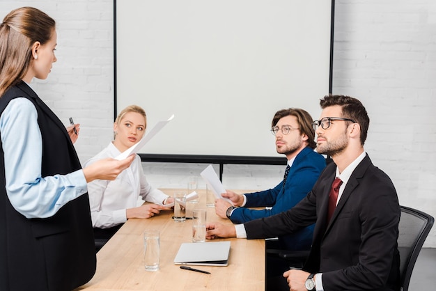 Team of business partners having meeting at modern office