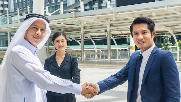 Team of business people shakes hands