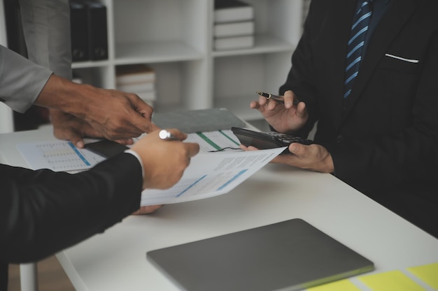 Team of business people working together in the meeting room office teamwork background charts and graphs banner double exposure successful teamworkbusiness planning concept