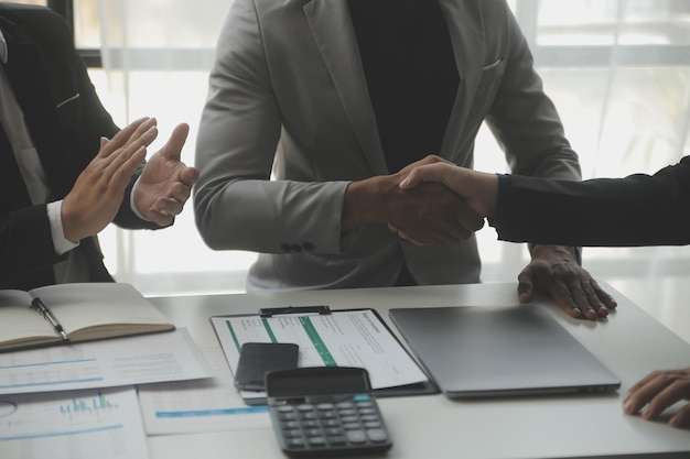 Team of business people working together in the meeting room office teamwork background charts and graphs banner double exposure successful teamworkbusiness planning concept