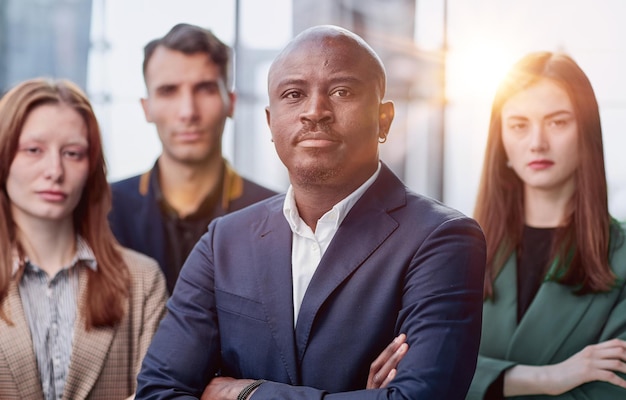 a team of businessmen stand in the lobby of a modern office