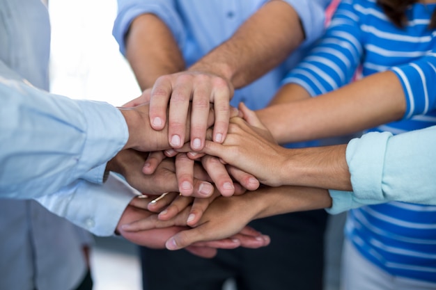 Team of businesspeople forming handstack