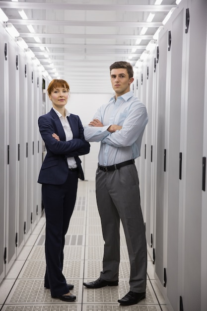 Team of computer technicians smiling at camera