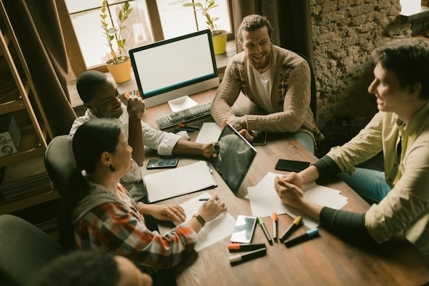 Team of creative people brainstorm in office