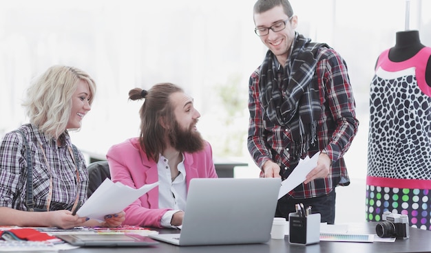 Team of designers discussing new ideas in the Studio.