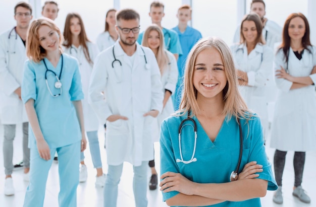 Team of diverse medical professionals applauds together