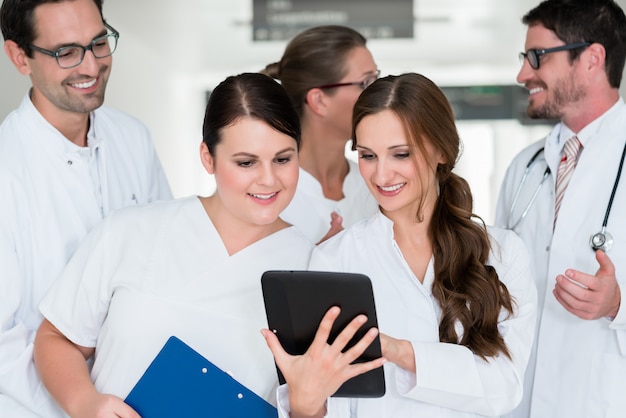 Team of doctors in hospital working on documents