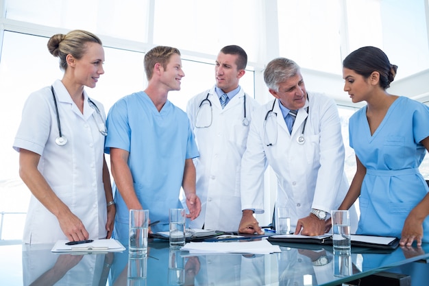 Team of doctors looking at their diaries