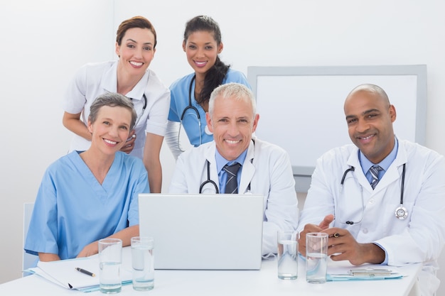 Team of doctors working on laptop