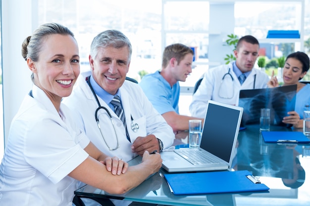 Team of doctors working on their files