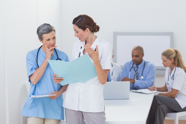 Team of doctors working on their files