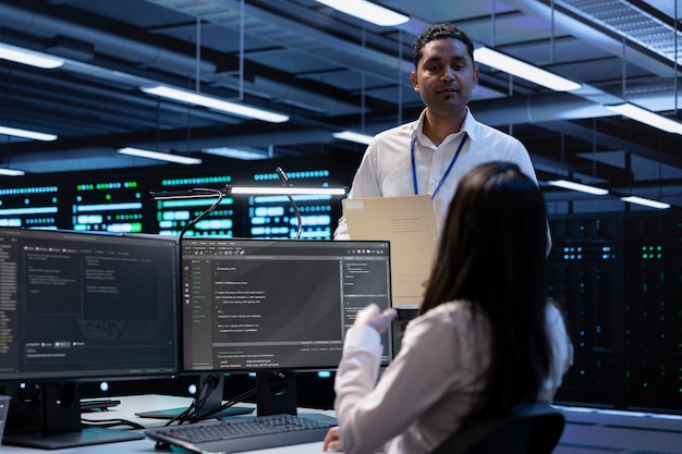 team of engineers in data center looking for firewall misconfigurations