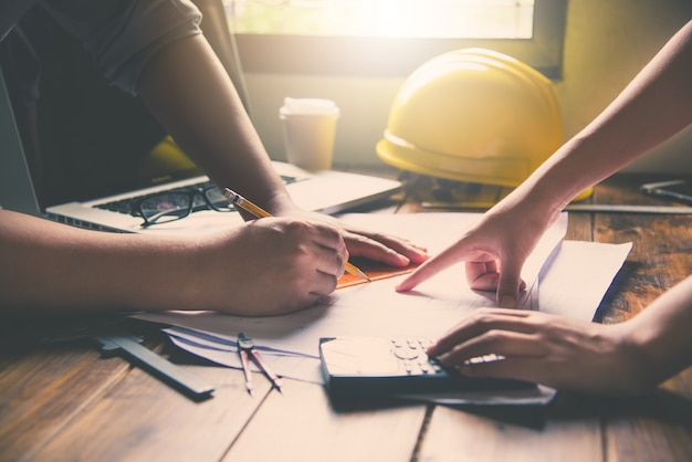 Team of engineers working together in a architect office.