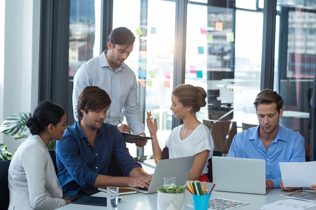 Team of graphic designers interacting with each other