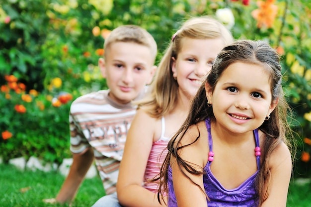 team group of happy child outdoor in nature have fun