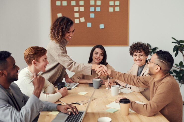 Team handshake handshake cooperation company meeting meeting room cooperation handshake shaking hand