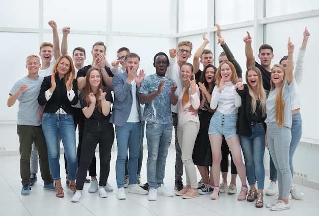 Team of happy young people standing together