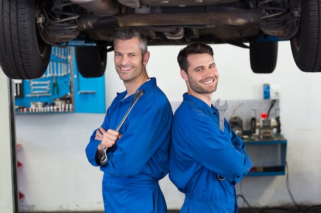 Team of mechanics smiling at camera